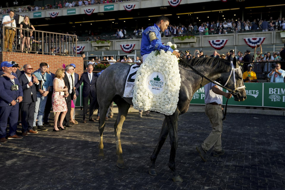Essential Quality (2), with jockey Luis Saez up, is led through the winner's circle after winning the 153rd running of the Belmont Stakes horse race, Saturday, June 5, 2021, at Belmont Park in Elmont, N.Y. (AP Photo/John Minchillo)