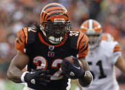 FILE - In this Nov. 27, 2011 file photo Cincinnati Bengals running back Cedric Benson runs for a touchdown in the first half of an NFL football game against the Cleveland Browns in Cincinnati. Benson, one of the most prolific rushers in NCAA and University of Texas history, has died in a motorcycle accident in Texas, Saturday, Aug. 17, 2019. He was 36. (AP Photo/David Kohl, file)