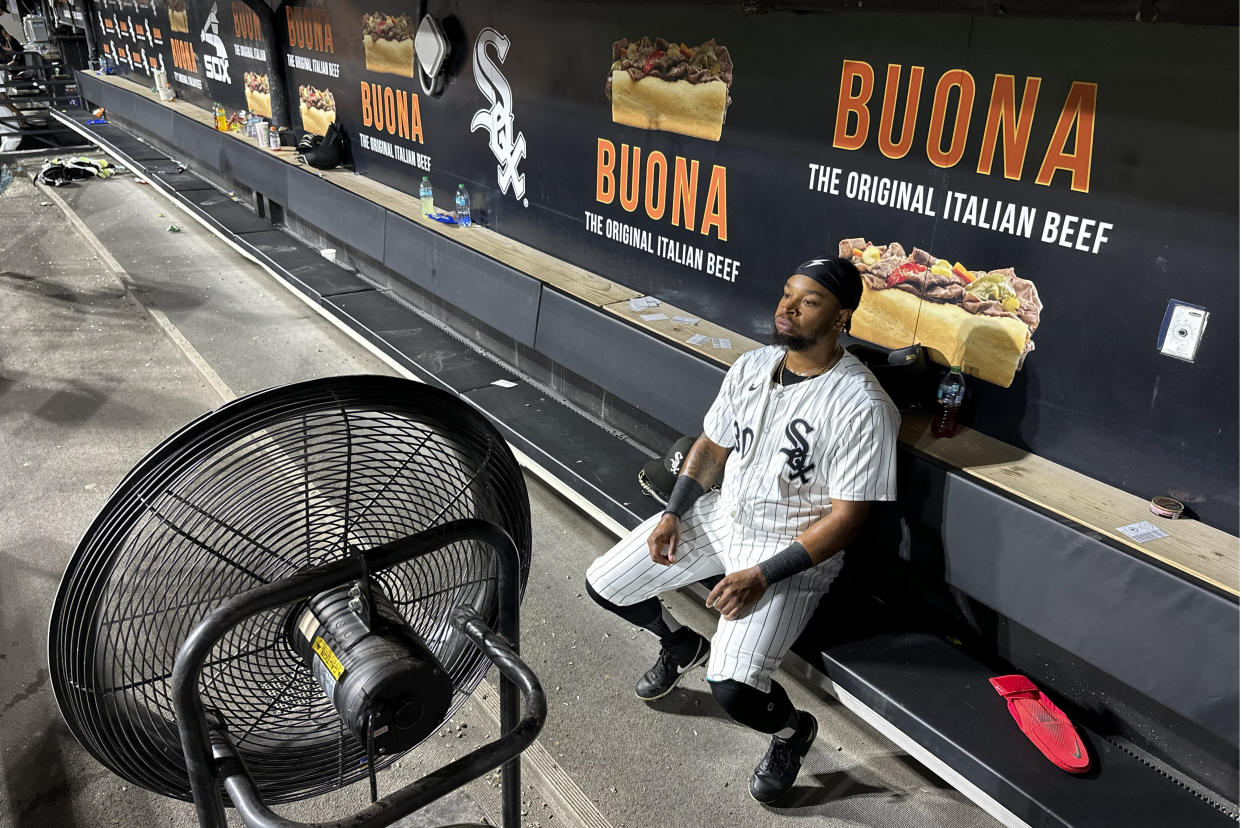 Chicago White Sox's Corey Julks sits in the end of the bench after the team's 5-3 loss to the New York Mets Saturday, Aug. 31, 2024, that saw the White Sox tie the franchise season record of 106 losses in Chicago. (AP Photo/Charles Rex Arbogast)