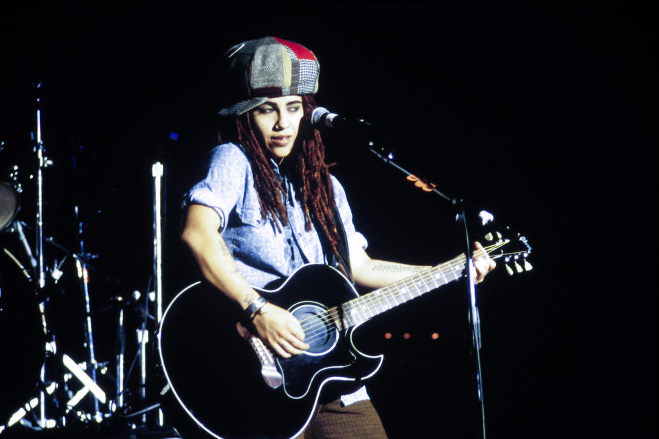 American Rock musician Linda Perry, of the group 4 Non Blondes, plays guitar as she performs onstage at Jones Beach, Wantagh, New York, September 4, 1993. 
