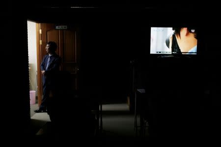 Moon Seoung-ok, president of the Headquarters of Reporting for Public Good, gives a lecture on how to earn money as a paparazzi during a class in Seoul, South Korea, September 30, 2016. REUTERS/Kim Hong-Ji