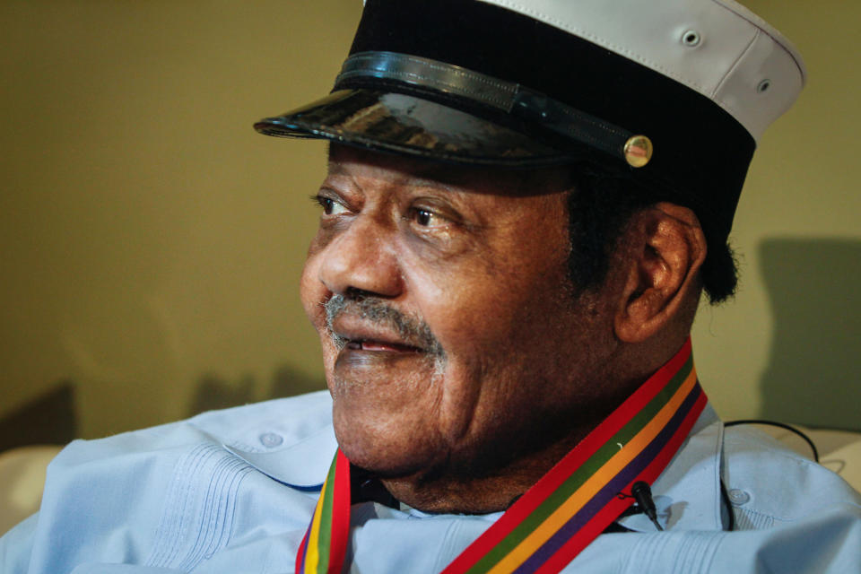 Legendary musician Fats Domino is named "Honorary Grand Marshall" of the Krewe of Orpheus, the star-studded Carnival club that traditionally parades the night before Mardi Gras, Friday, Dec. 20, 2013 in New Orleans. (AP Photo/Doug Parker).