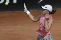 Poland's Iga Swiatek returns the ball to Cori Gauff, of the United States, during their semi-final match at the Italian Open tennis tournament, in Rome, Saturday, May 15, 2021. (AP Photo/Gregorio Borgia)