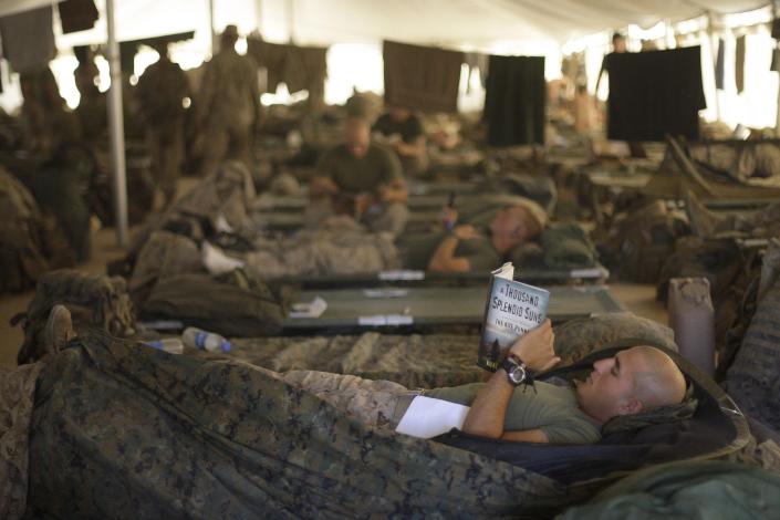 U.S. Marines from the 2nd Marine Expeditionary Brigade rest inside a tent at Camp Leatherneck in Afghanistan's Helmand province on June 9, 2009. (AP Photo/David Guttenfelder, File)