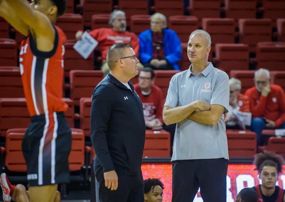 Bradley men's basketball head coach Brian Wardle, left, chats with new assistant coach Brian Jones during the Red-White Showcase on Saturday, Oct. 15, 2022 at Renaissance Coliseum.