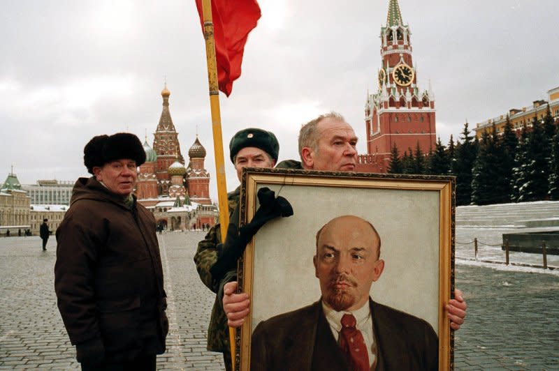 A pro-Communist Moscovite holds Vladimir Lenin's portrait during a ceremony to mark the anniversary of the Soviet leader's death at Moscow's Red Square on January 21, 2001. On November 17, 1903, the Russian Social Democratic Labour Party splits into two factions: the Bolsheviks (Russian for "majority"), led by Lenin, and the Mensheviks (Russian for "minority"), led by Julius Martov. File Photo by Maxim Marmur/UPI