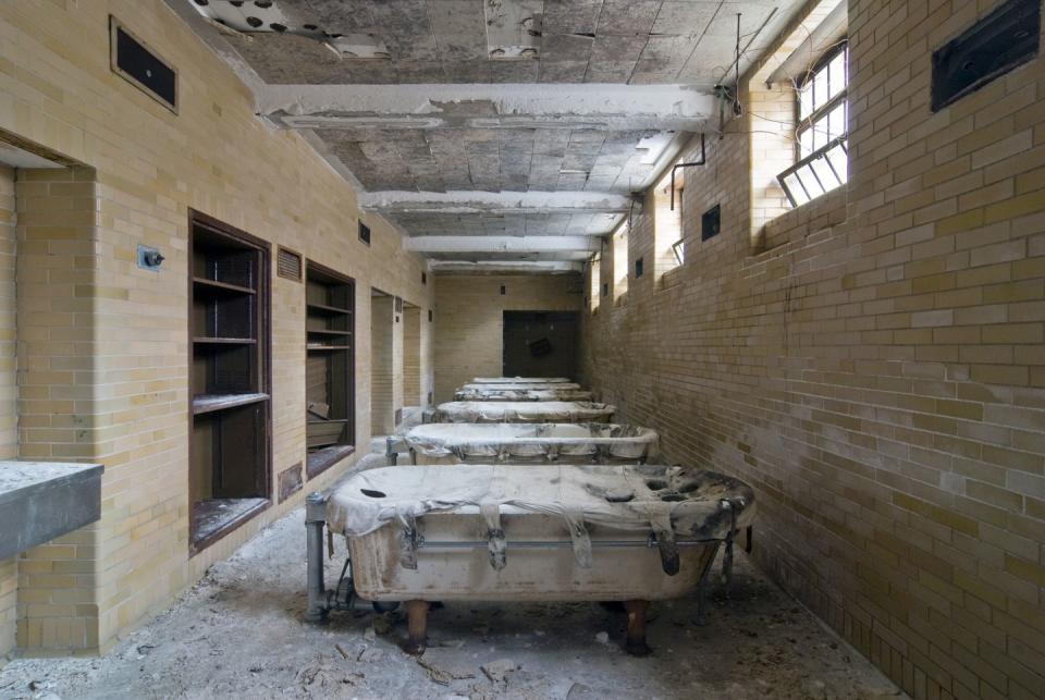 <p>A row of hydrotherapy tubs sit side by side - canvas enclosures still intact.</p>