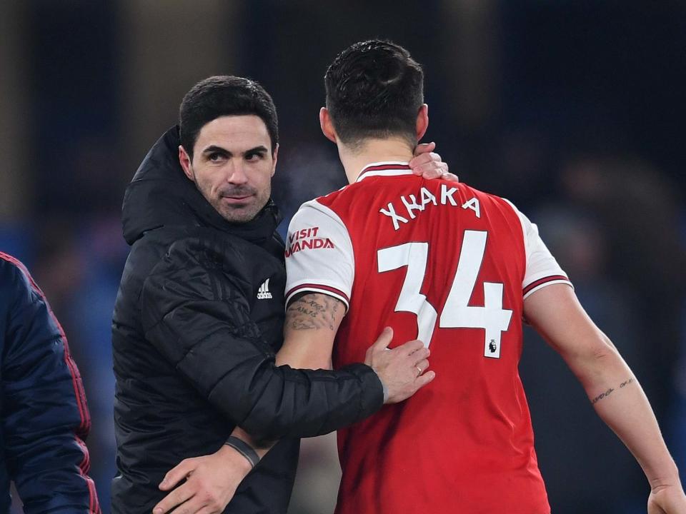 Arsenal head coach Mikel Arteta celebrates with Granit Xhaka: Arsenal FC via Getty Images