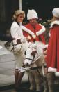 <p>During a visit to a children's hospital near Christmas, Princess Diana ran into a couple festive Santas (and their furry friends).</p>