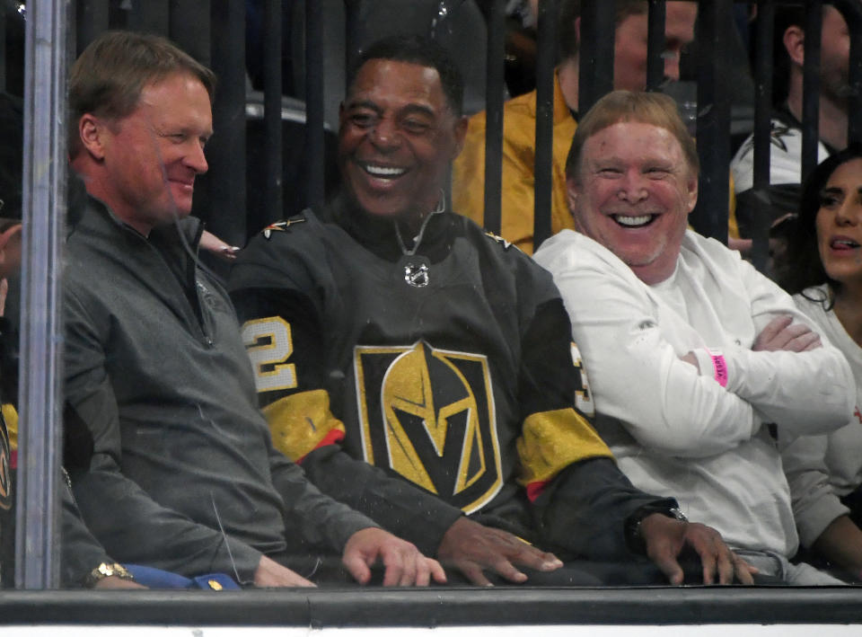 LAS VEGAS, NEVADA - FEBRUARY 13:  (L-R) Las Vegas Raiders head coach Jon Gruden, Pro Football Hall of Fame member and former Raider Marcus Allen and Raiders owner and managing general partner Mark Davis attend a game between the St. Louis Blues and the Vegas Golden Knights at T-Mobile Arena on February 13, 2020 in Las Vegas, Nevada. The Golden Knights defeated the Blues 6-5 in overtime.  (Photo by Ethan Miller/Getty Images)