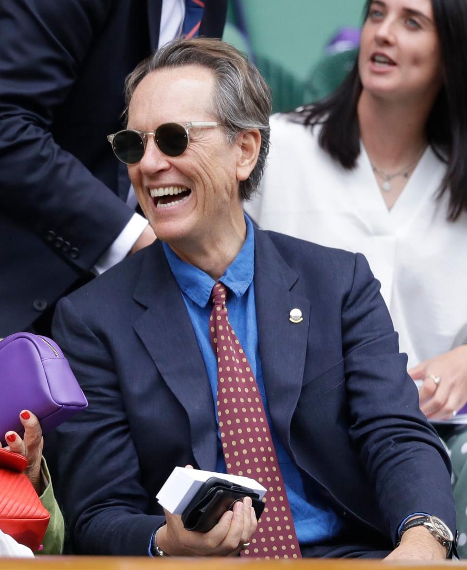 smiles from his seat in the Royal Box during the day eight action.