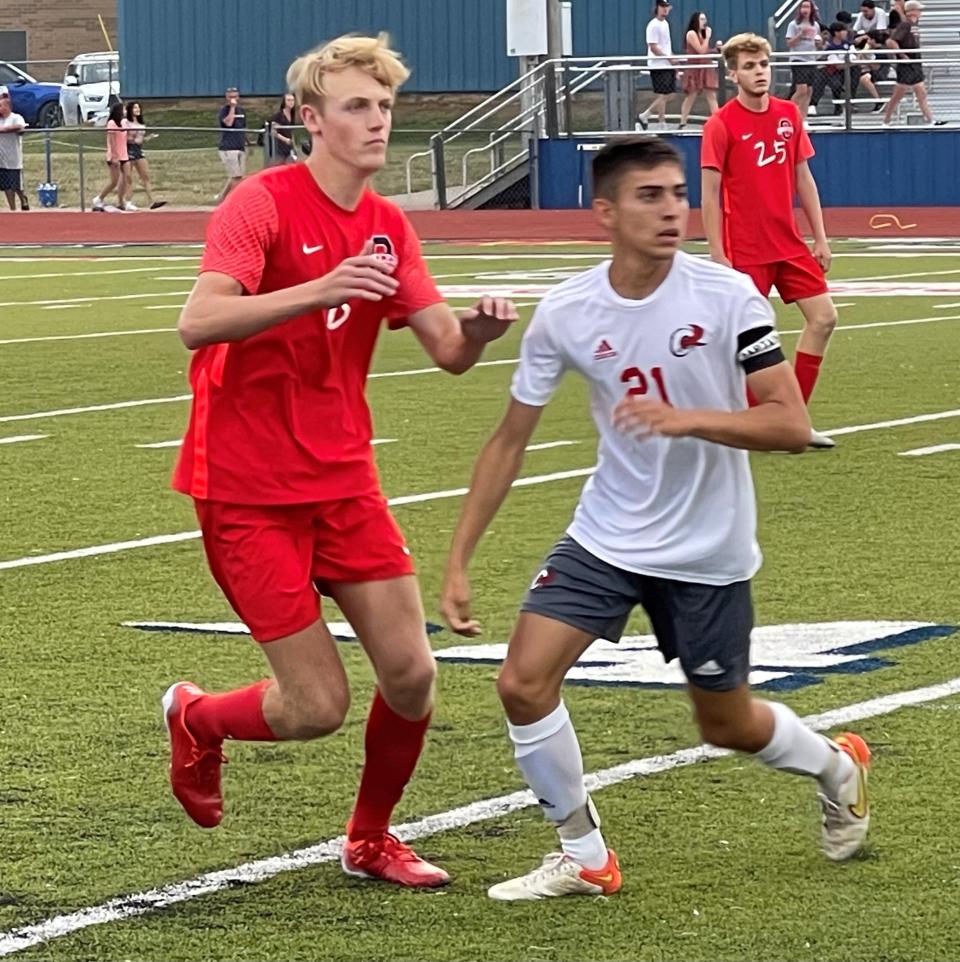Oakland's Riley Clothier (left) awaits a pass as an Ooltewah player defends during Saturday's Class AAA sectional, won by the Patriots 3-0 to advance to Spring Fling.