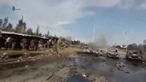 A still image taken from a video uploaded on social media on April 15, 2017, shows burnt out buses on road, scattered debris lying nearby and injured people being tended to away from buses said to be in Aleppo, Syria. Social Media Website via Reuters TV A