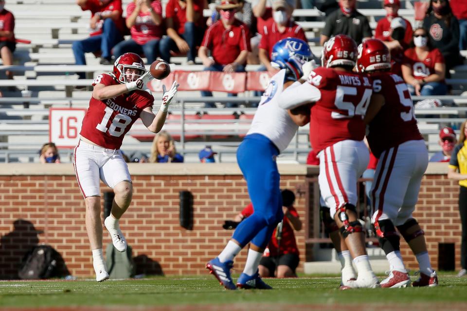 OU's Austin Stogner (18) catches a touchdown pass in a during a 62-9 win against Kansas at Gaylord Family-Oklahoma Memorial Stadium in Norman on Nov. 7, 2020.