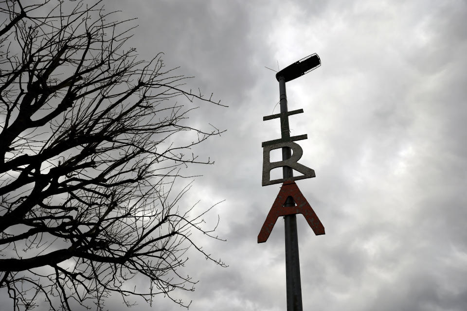 An Irish Republican Army logo is attached to a lamppost in Londonderry, Northern Ireland, Monday, April 3, 2023. It has been 25 years since the Good Friday Agreement largely ended a conflict in Northern Ireland that left 3,600 people dead. (AP Photo/Peter Morrison)