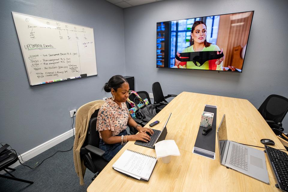 Melanie Blue works in a conference room in the BizLinc business incubator in Lake Wales' Northwest Neighborhood. Florida Development Corporation received a three-year contract worth $1.2 million in 2022 to operate BizLinc,