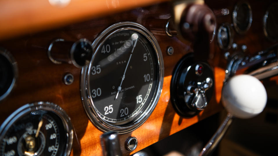 A close-up of the dashboard inside a 1930 Mercedes-Benz SS Cabriolet.