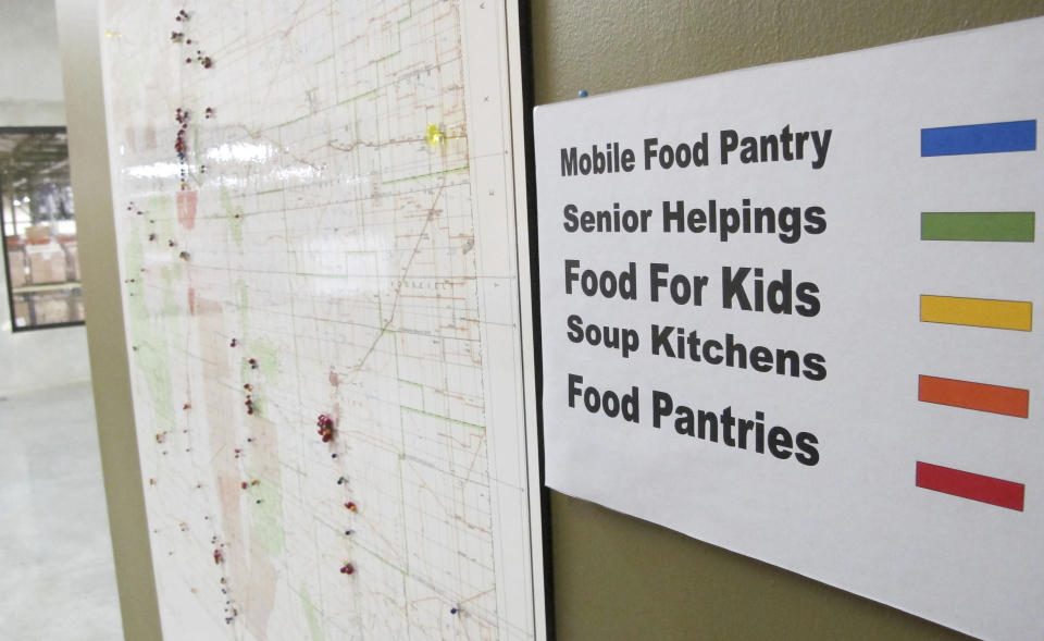 FILE - This June 21, 2013 image shows a map at Roadrunner Food Bank in Albuquerque, N.M., that depicts food distribution points across New Mexico. States with some of the nation's strictest abortion laws are also some of the hardest places to have and raise a healthy child, especially for the poor, according to an analysis of federal data by The Associated Press. A weaker safety net pattern isn't consistent for all measurements, with some Democratically controlled states, like New Mexico, that have less restrictive abortion laws also measuring poorly in some categories. (AP Photo/Susan Montoya Bryan, File)