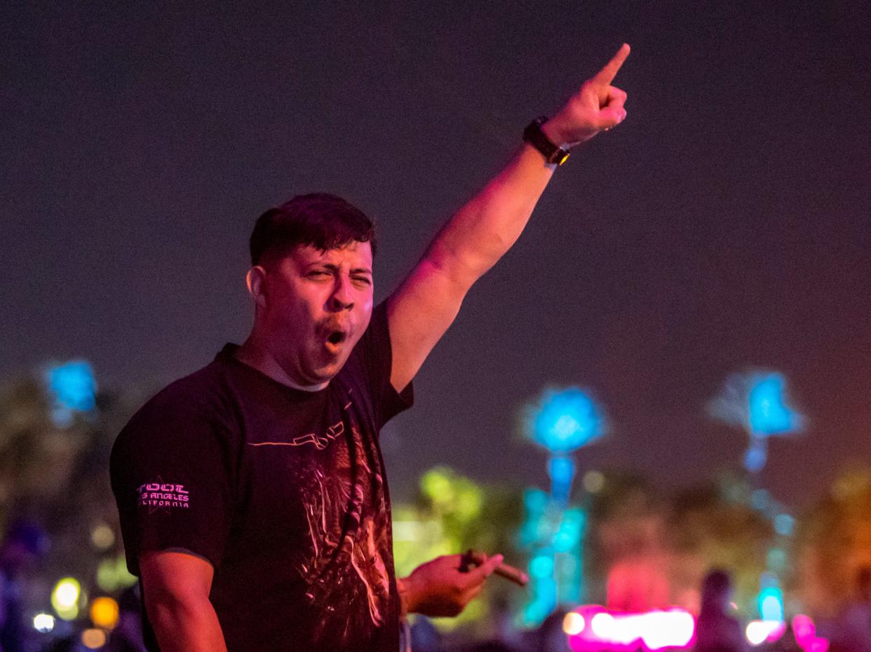 A festivalgoer rocks out to Tool's set at Power Trip Music Festival at the Empire Polo Club in Indio, Calif., Sunday, Oct. 8, 2023.