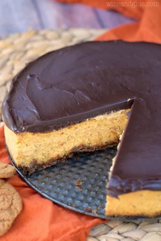 <p>Wine & Glue</p><p>This pumpkin cheesecake is insanely smooth, pumpkiny, and delicious with a gingersnap crust and a deeply rich and smooth chocolate ganache top! A keeper for sure! </p><p><strong>Get the recipe: <a href="https://www.simplejoy.com/pumpkin-cheesecake-frosted-in-chocolate-ganache/" rel="nofollow noopener" target="_blank" data-ylk="slk:Pumpkin Cheesecake Frosted In Chocolate Ganache;elm:context_link;itc:0;sec:content-canvas" class="link ">Pumpkin Cheesecake Frosted In Chocolate Ganache</a></strong></p>