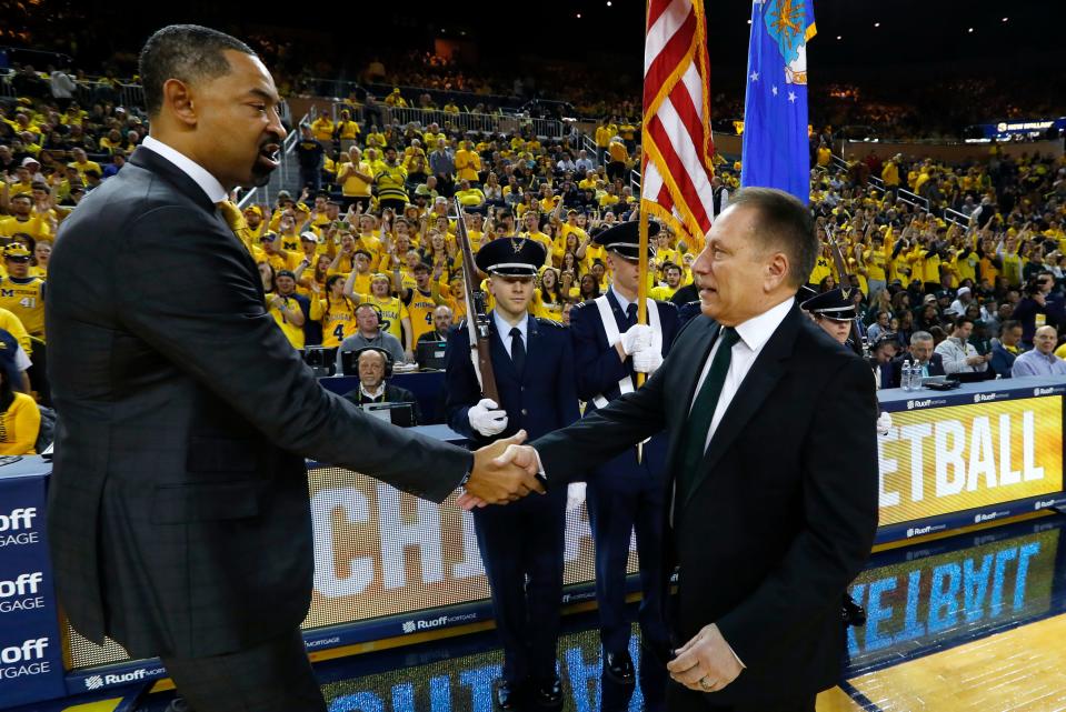 Michigan coach Juwan Howard, left, and Michigan State coach Tom Izzo shake hands before their game in Ann Arbor, Saturday, Feb. 8, 2020.