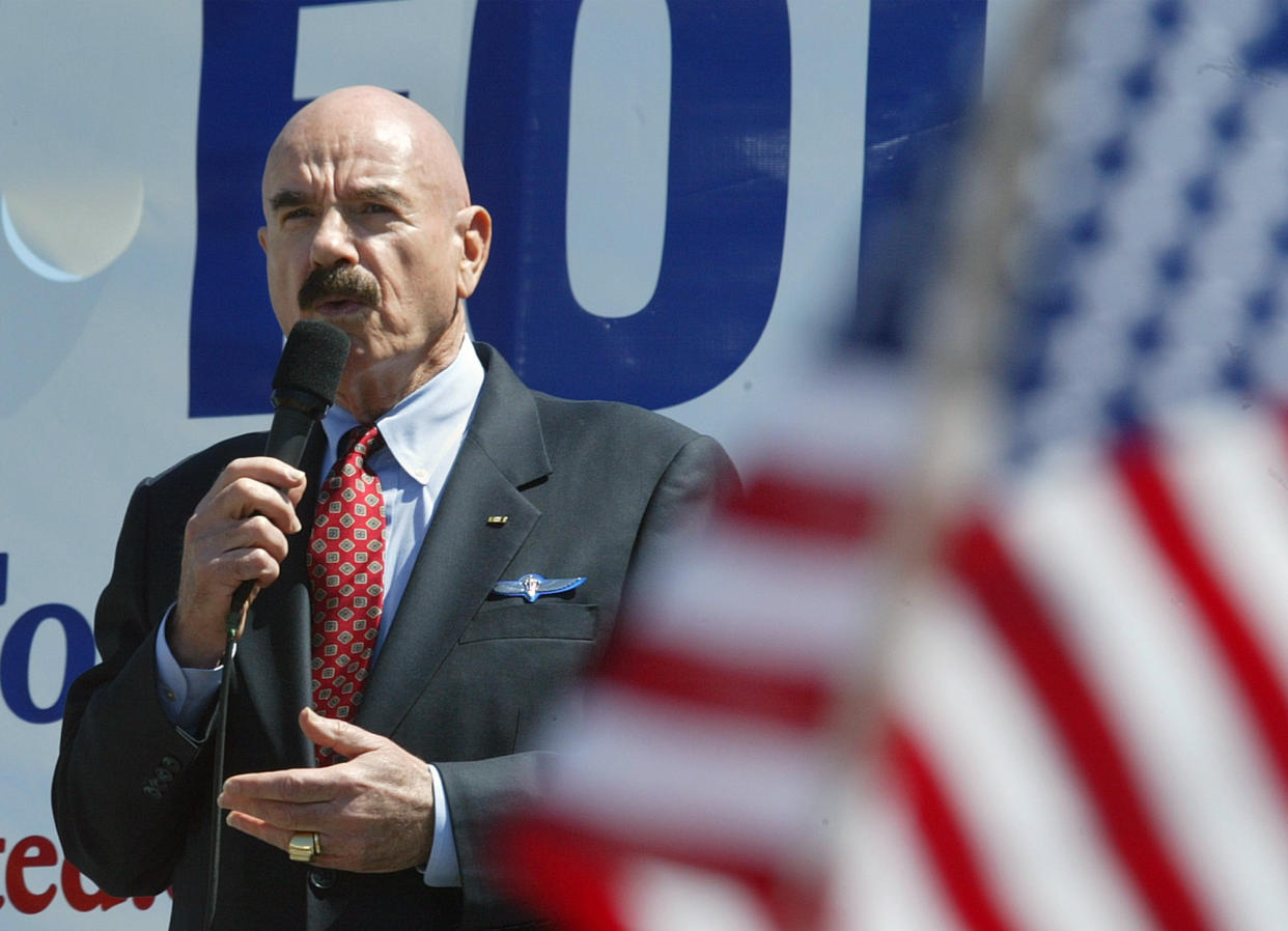 FILE - In this Saturday, April 12, 2003, file photo, talk radio host G. Gordon Liddy speaks at a rally for troops in Washington. In Washington, 10 blocks from an anti-war demonstration, supporters of the war effort drew thousands to their own rally. Liddy, a mastermind of the Watergate burglary and a radio talk show host after emerging from prison, has died at age 90. His son, Thomas Liddy, confirmed the death Tuesday, March 30, 2021, but did not reveal the cause. (AP Photo/Lisa Nipp, File)