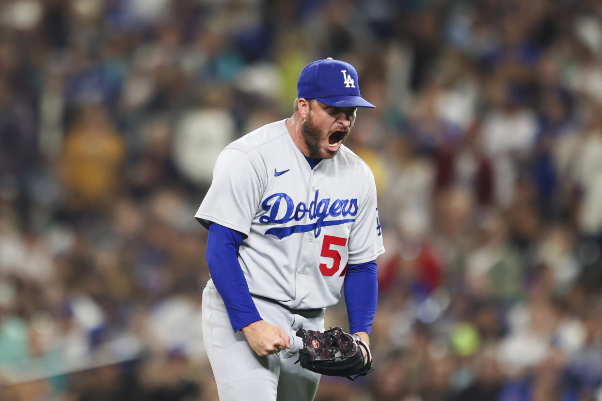 Los Angeles Dodgers relief pitcher Ryan Brasier reacts after striking out Seattle Mariners' Teoscar Hernandez to end the eight inning of a baseball game Saturday, Sept. 16, 2023, in Seattle. (AP Photo/Maddy Grassy)