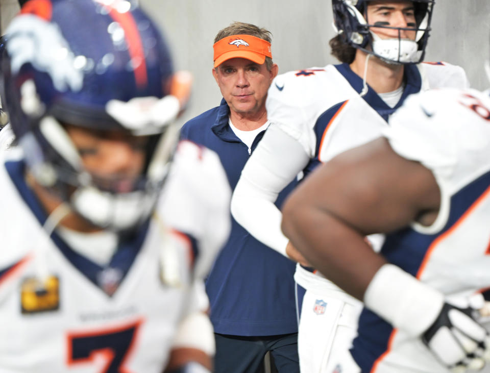 LAS VEGAS, NEVADA - JANUARY 7: Denver Broncos head coach Sean Payton, center, stands between Denver Broncos quarterback Russell Wilson (3), left, and Denver Broncos quarterback Jarrett Stidham (4), right, as the team comes out of the visiting tunnel before the game at Allegiant Stadium in Las Vegas, Nevada on January 7, 2024. The Las Vegas Raiders took on Denver Broncos during week 18 of NFL season. (Photo by  RJ Sangosti/MediaNews Group/The Denver Post via Getty Images)