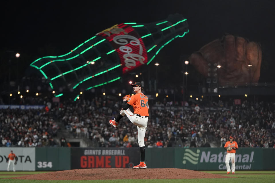 San Francisco Giants' Sean Hjelle pitches against the St. Louis Cardinals during the seventh inning of a baseball game in San Francisco, Friday, May 6, 2022. (AP Photo/Jeff Chiu)