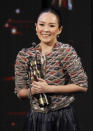 Chinese actress Zhang Ziyi reacts after winning the Best Actress award for her role in the movie ' The Grandmaster ' at the at the 33rd Hong Kong Film Awards in Hong Kong, Sunday, April 13, 2014. (AP Photo/Vincent Yu)