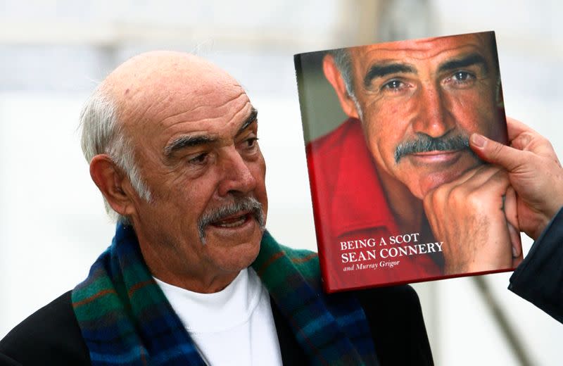 FILE PHOTO: Sean Connery stands next to a copy of his new autobiography "Being A Scot" during a photocall for its launch at the Edinburgh International Book Festival