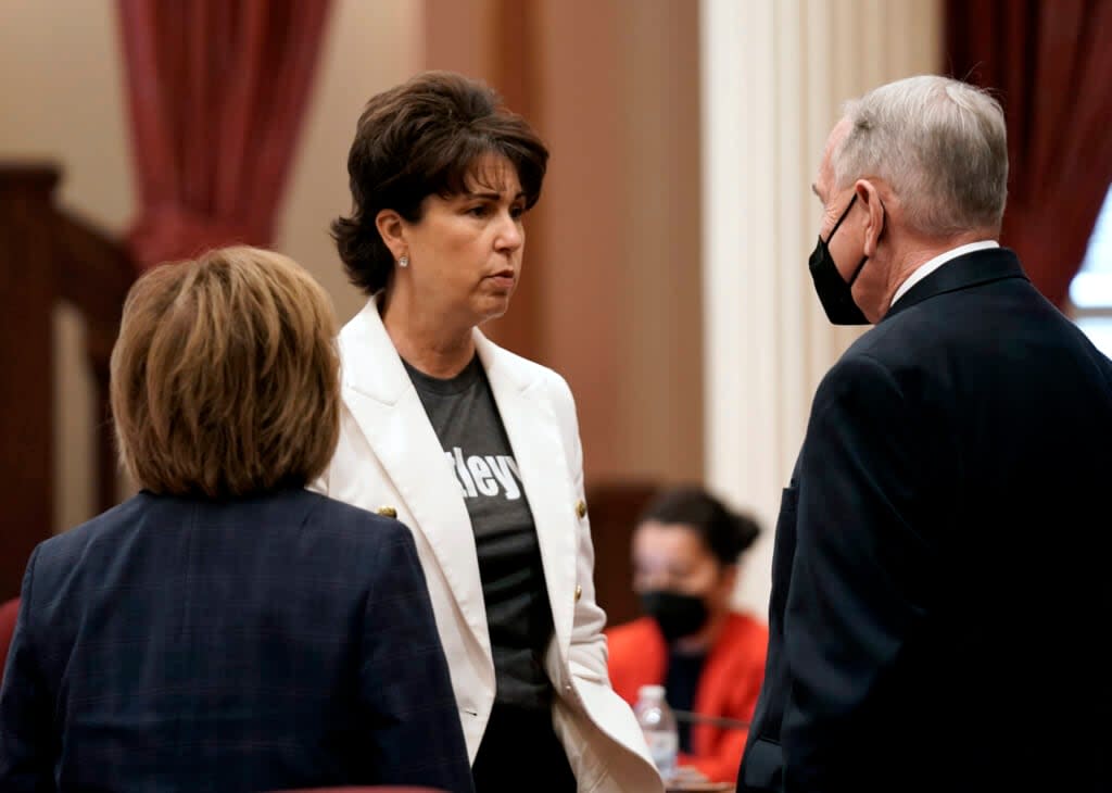 State Sen. Connie Leya, D-Chino, center, talks with fellow Democratic state Senators, Maria Elena Durazo, of Los Angeles, left and Richard Roth, of Riverside, at the Capitol in Sacramento, Calif., Wednesday, Aug. 31, 2022. (AP Photo/Rich Pedroncelli)