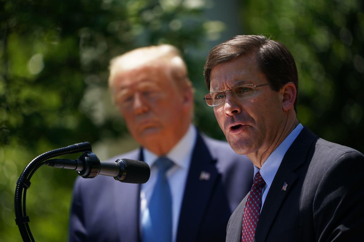 Defense Secretary Mark Esper, with President Donald Trump, speaks on vaccine development on May 15, 2020, in the Rose Garden of the White House. (Photo: MANDEL NGAN via Getty Images)