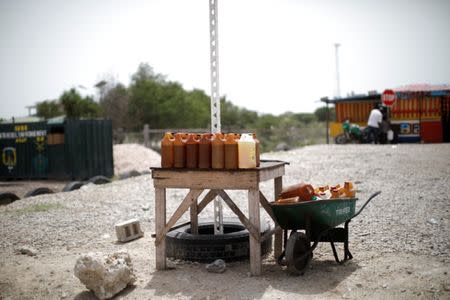 Containers with fuel displayed for sale at a stand on the outskirts of Port-au-Prince, Haiti, July 12, 2018. REUTERS/Andres Martinez Casares