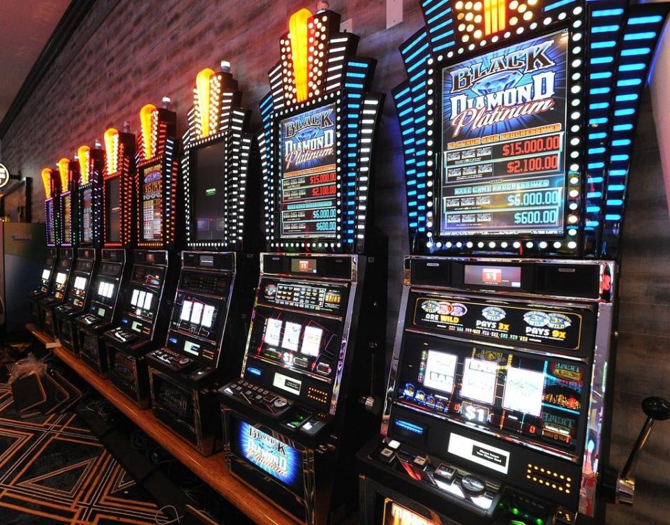 Slot machines line the walls at Bally's Tiverton Casino & Hotel.