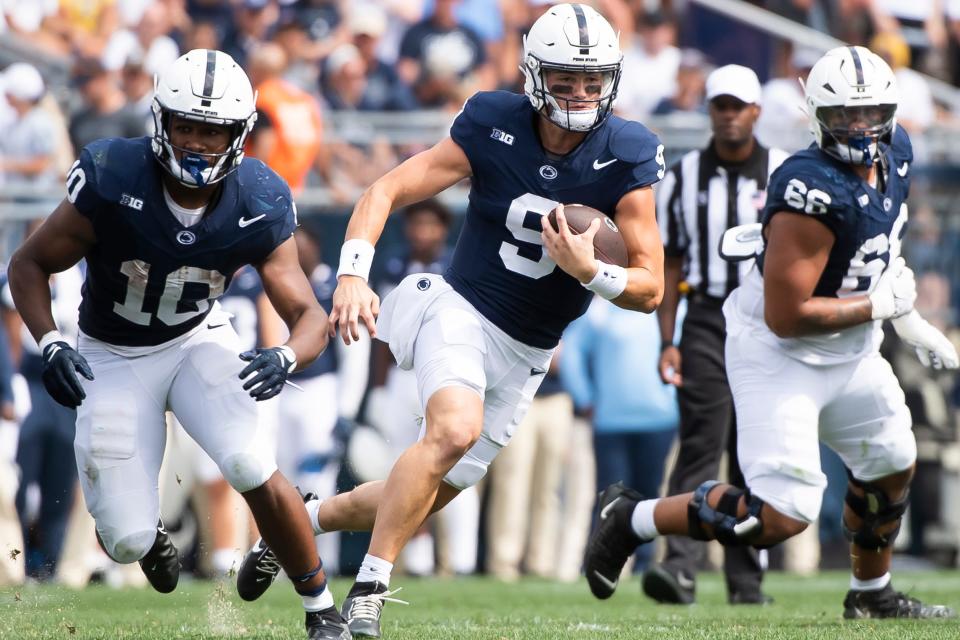 Penn State quarterback Beau Pribula (9) tucks the ball and runs during the third quarter of a NCAA football game against Delaware Saturday, Sept. 9, 2023, in State College, Pa.