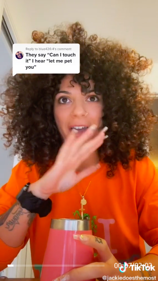 TikTok screenshot of Jaclyn with the words, "They say 'can I touch it,' I hear 'can I pet you?'"