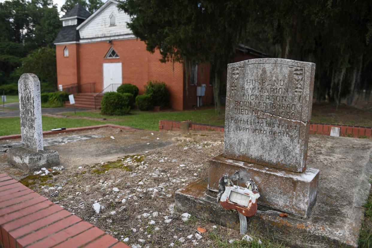 A small cemetery sits in front of Spirit Creek Baptist Church on Tuesday, Sept. 12, 2023.