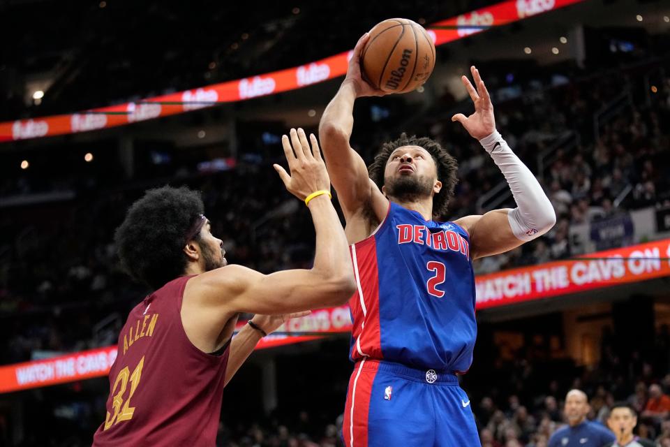 Pistons guard Cade Cunningham shoots over Cavaliers center Jarrett Allen in the second half of the Pistons' 128-121 loss on Wednesday, Jan. 31, 2024, in Cleveland.