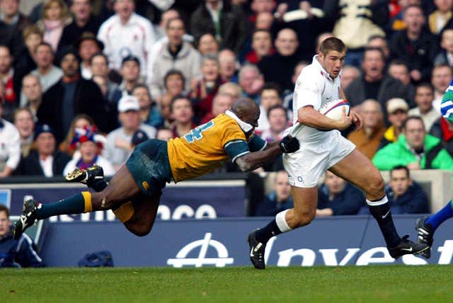 England’s Ben Cohen (right) is tackled by Australia’s Wendell Sailor during an international friendly at Twickenham. England claimed an eventual 21-15 victory