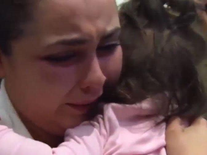 Harrowing footage shows mother reunited with baby after being separated for month under Trump border policy