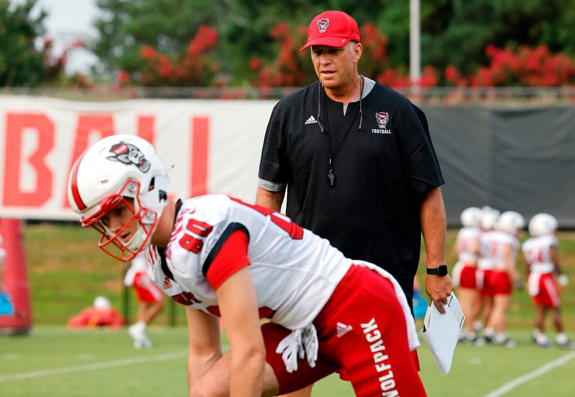 N.C. State head coach Dave Doeren watches as wide receiver Bradley Rozner (80) prepares to run a drill during the Wolfpack’s first fall practice in Raleigh, N.C., Wednesday, August 2, 2023. Ethan Hyman/ehyman@newsobserver.com