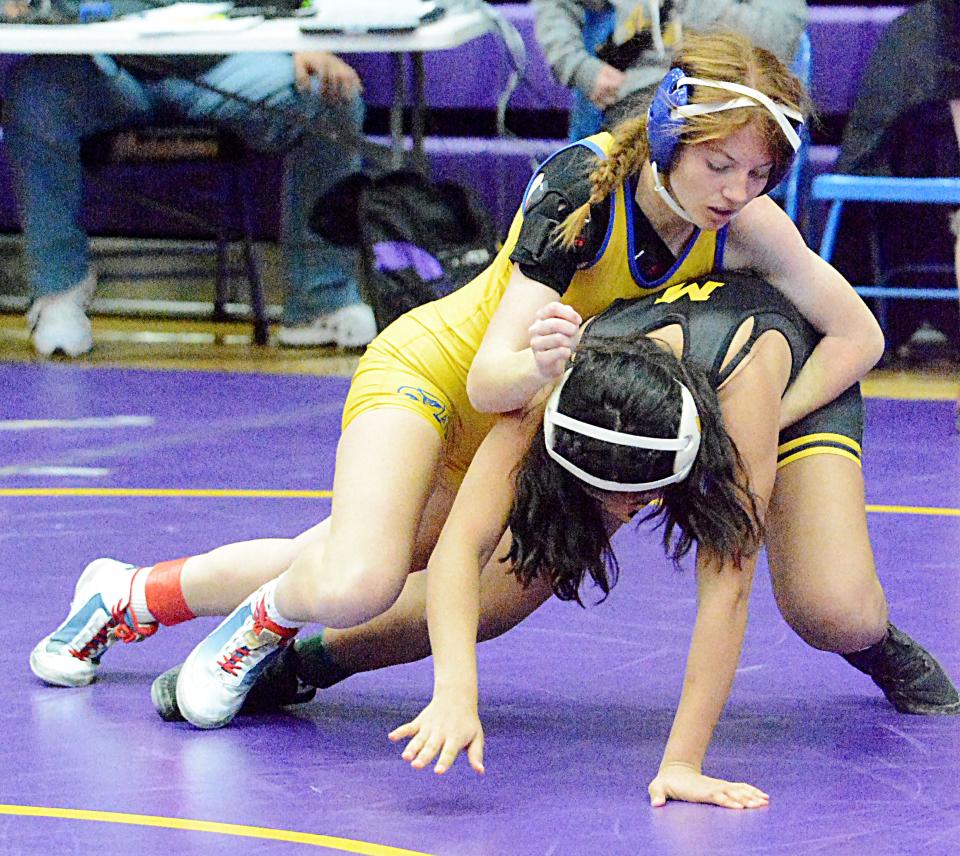 Aberdeen Central's Madyson Gillen works against Mitchell's Danny Borja during their girls match in the Marv Sherrill Duals wrestling tournament on Saturday, Dec. 3, 2022 in the Civic Arena.