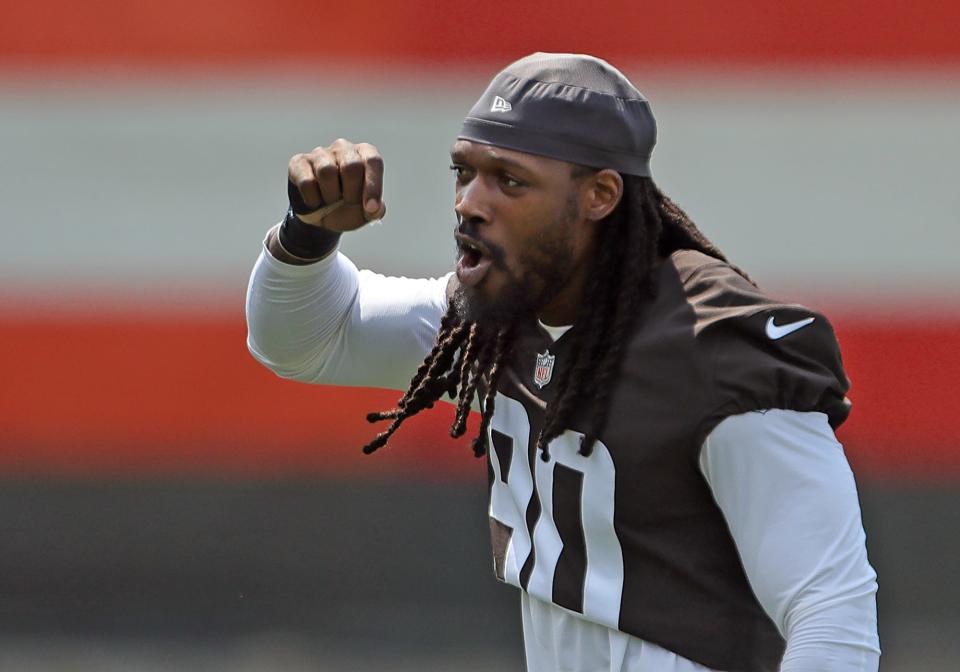 Cleveland Browns defensive end Jadeveon Clowney chants along with fans during NFL football training camp, Friday, July 30, 2021, in Berea, Ohio.