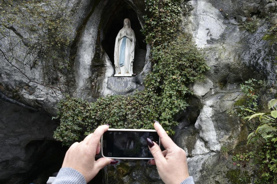 Pope Benedict XVI blesses worshippers as he arrives at the Massabielle cave of the Lourdes shrine, in Lourdes, France, in 2008. About <a href="http://www.latimes.com/travel/la-tr-europe-lourdes-photo.html">6 million people</a>&nbsp;are drawn to&nbsp;Lourdes every year to pray at the place where Mary is said to have appeared to a teenager named&nbsp;Bernadette Soubirous. Many of the pilgrims are sick and disabled and come to the spot in hopes of&nbsp;healing.