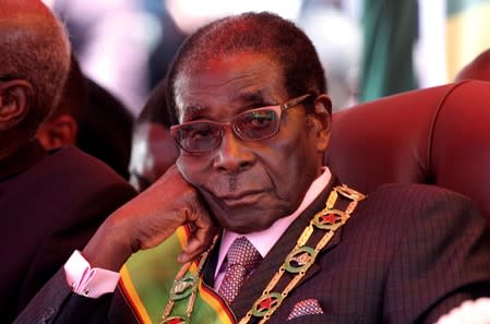 FILE PHOTO: Zimbabwe's President Mugabe looks on during a rally marking Zimbabwe's 32nd independence anniversary celebrations in Harare
