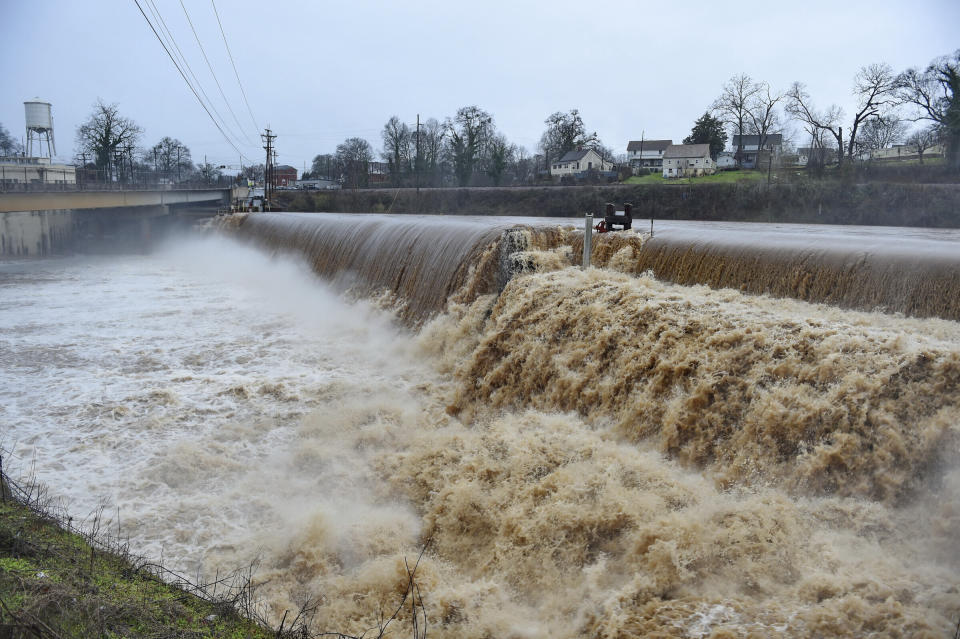 The Saluda River rages over a spillway after more than four inches of rain fell in Pelzer, S.C. Thursday, Feb. 6, 2020. (AP Photo/Richard Shiro)
