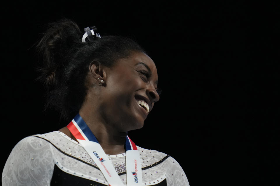 Simone Biles celebrates after winning all-around at the U.S. Classic gymnastics competition Saturday, Aug. 5, 2023, in Hoffman Estates, Ill. (AP Photo/Erin Hooley)