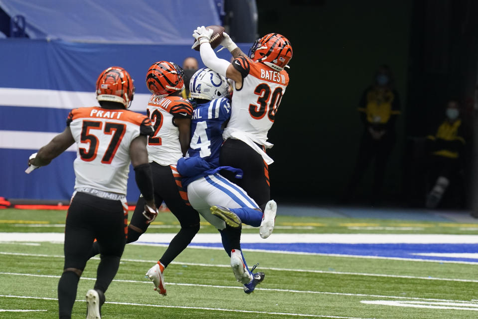 Cincinnati Bengals' Jessie Bates (30) intercepts a pass intended for Indianapolis Colts' Zach Pascal (14) during the second half of an NFL football game, Sunday, Oct. 18, 2020, in Indianapolis. (AP Photo/Michael Conroy)