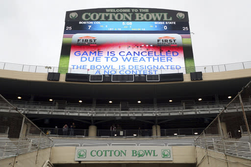 The First Responder Bowl between Boston College and Boise State was cancelled due to weather and was designated a no contest after multiple lighting delays Wednesday, Dec. 26, 2018, in Dallas. (AP Photo/Richard W. Rodriguez)